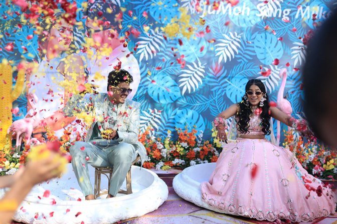 Haldi ceremony with a tropical backdrop