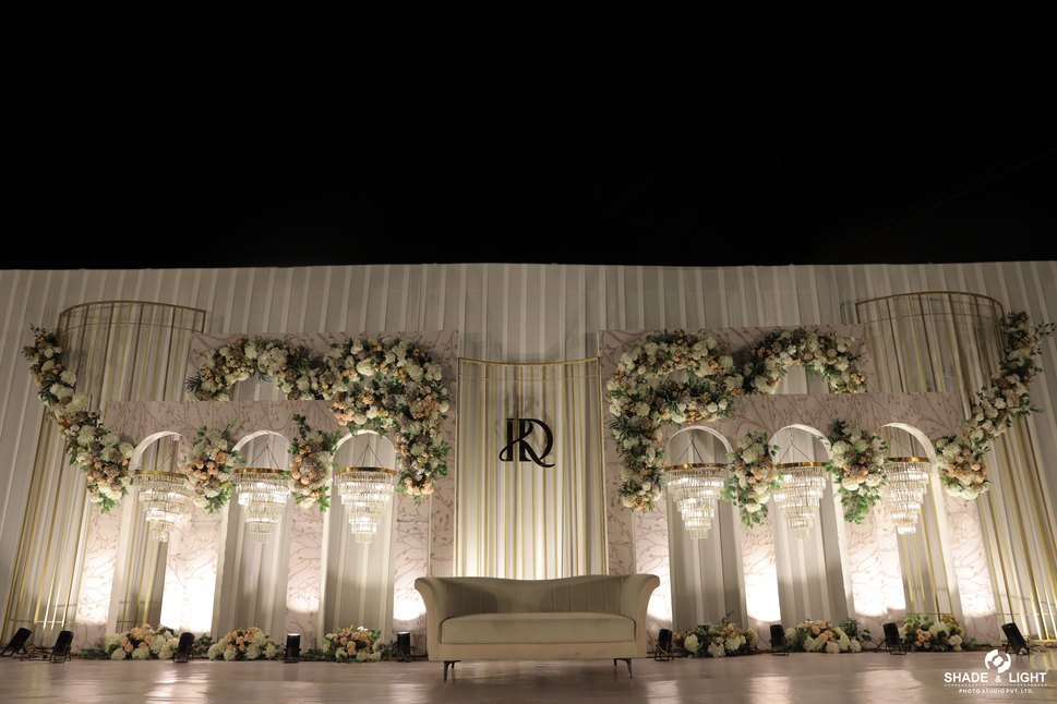 Reception stage with floral arches